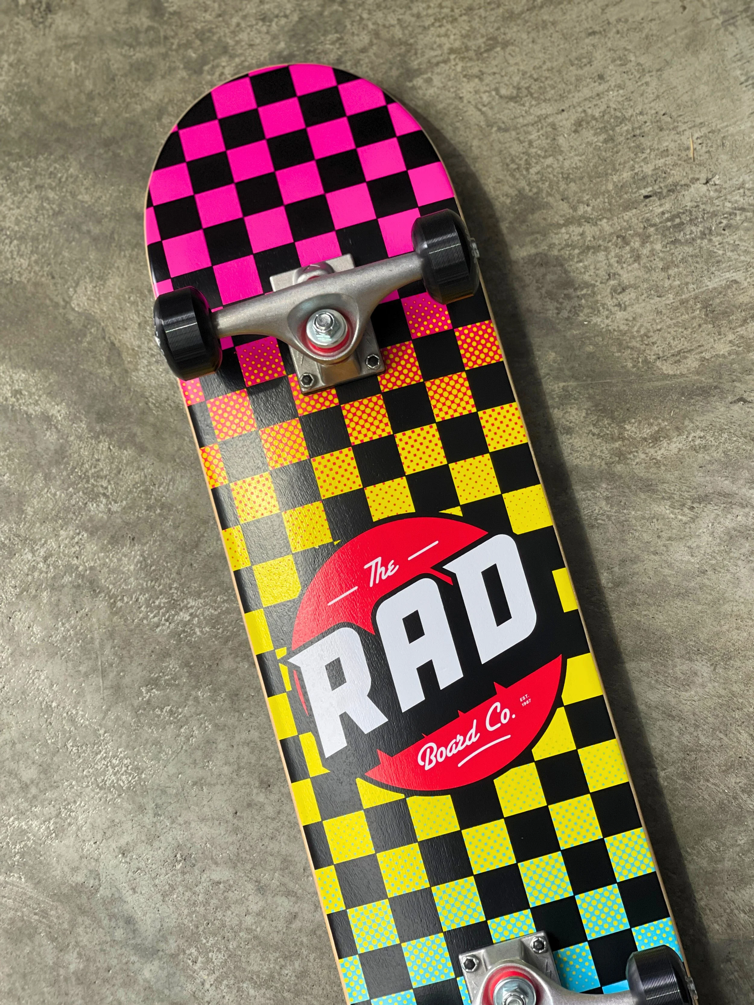 RAD BOARD CO. CHECKERS DUDE CREW COMPLETE NEON FADE 7.75 — SURF TRAX™